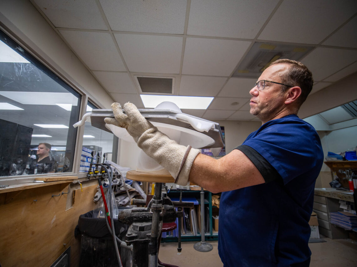Team member working on a mold for a custom prosthetic