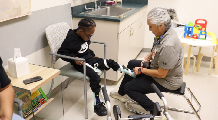 Therapist and pediatric patient.