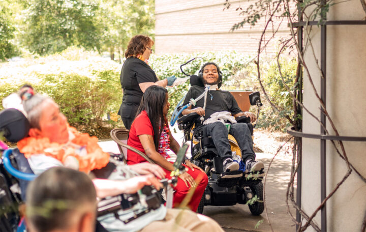 Residents and therapists at an event at the Methodist Specialty Care Center