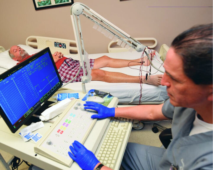 A. Arturo Leis, M.D. with a patient