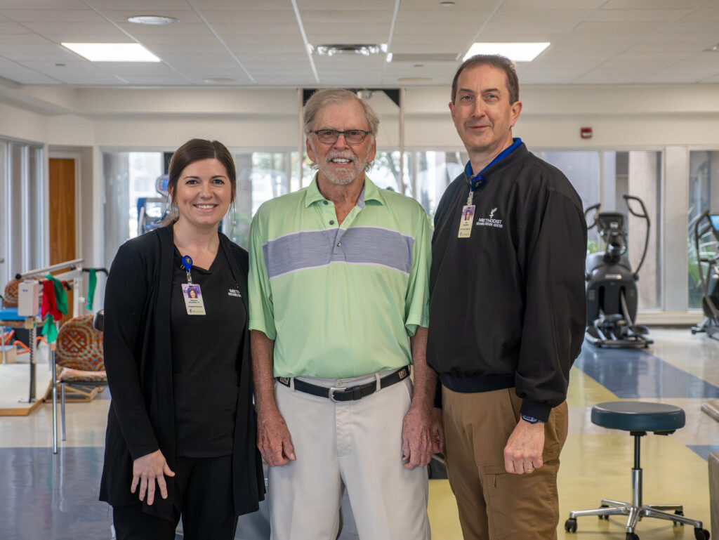 Robert H. posing with his therapists